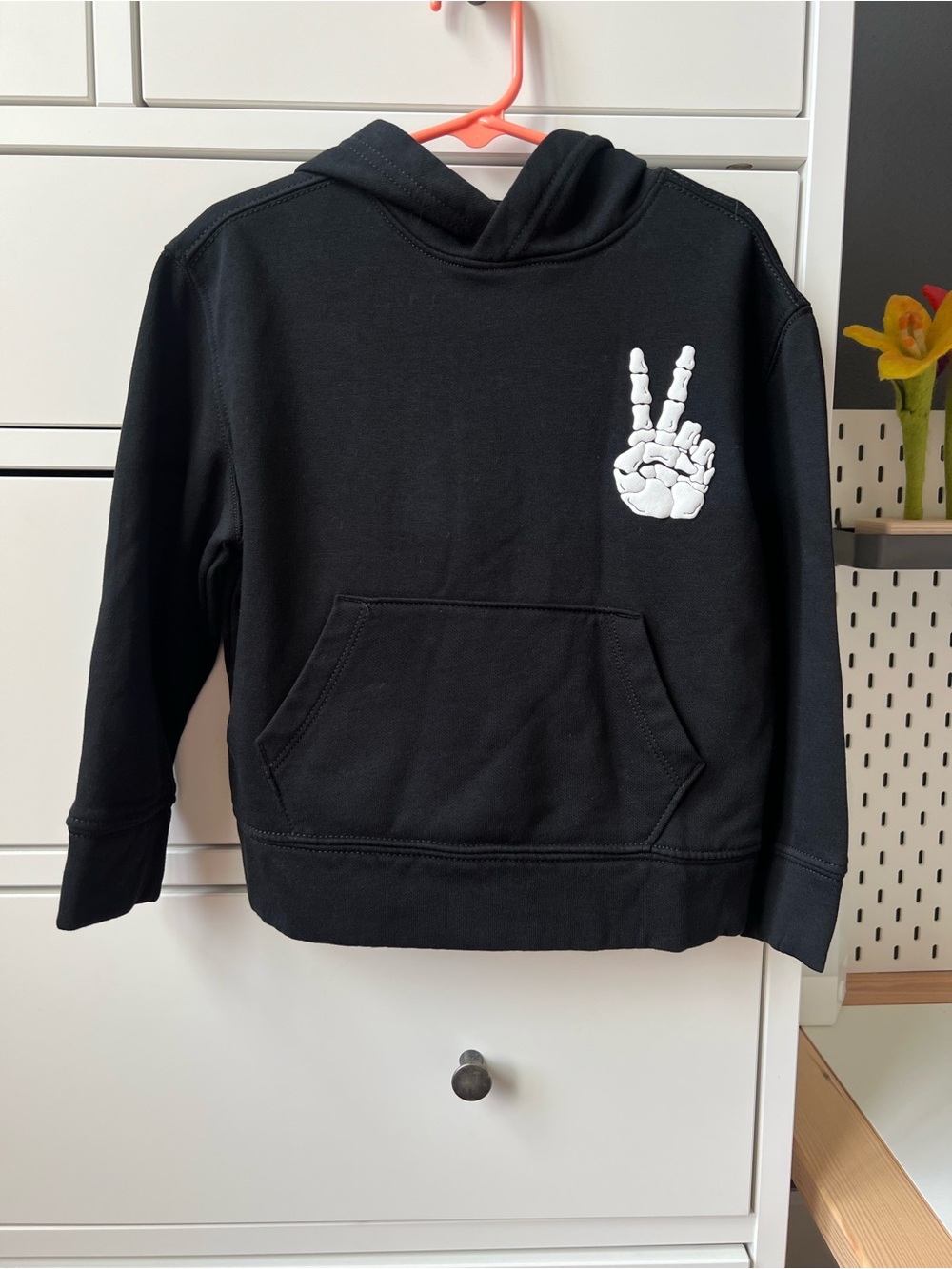 Kids Black Hoodie with White Skeleton Peace Hand Graphic
